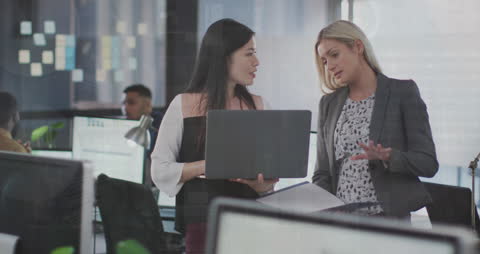 Diverse Female Colleagues Collaborate with Digital Interface Overlay