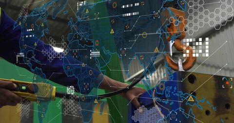 Technician Adjusting Industrial Machinery with Futuristic Map Overlay