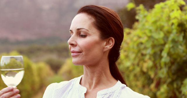 Woman Enjoying a Glass of White Wine in Vineyard - Download Free Stock Images Pikwizard.com