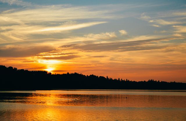 Serene Sunset Over Calm Lake Reflecting Beautiful Sky - Download Free Stock Photos Pikwizard.com