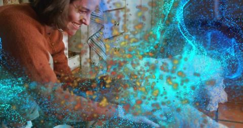 Woman smiling and reaching in cozy kitchen with blue-gold particle light overlay
