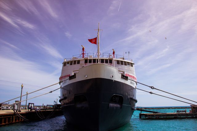 Large Docked Cruise Ship at Marina on Sunny Day - Download Free Stock Photos Pikwizard.com