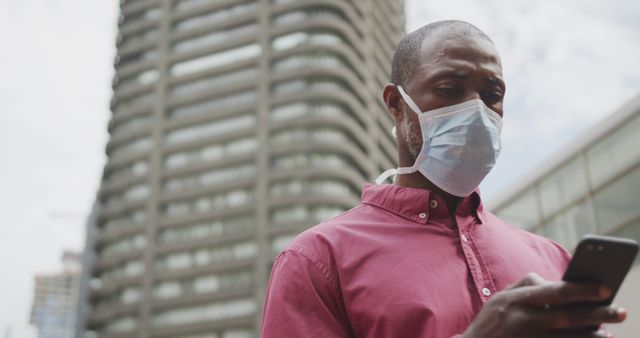 Man Wearing Face Mask Using Smartphone in Urban Setting - Download Free Stock Images Pikwizard.com