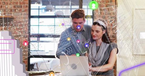 Professionals analyzing data visualizations on laptop