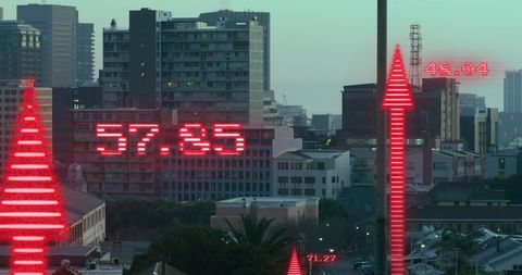 Rising financial data display over cityscape