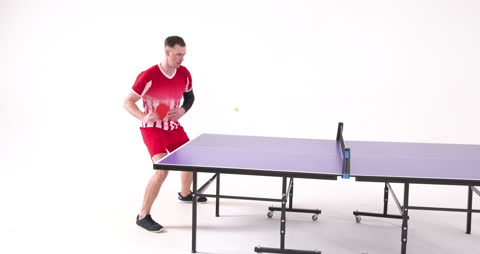 Athletic Man Intensely Playing Table Tennis on White Background