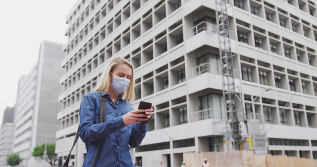 Woman Wearing Mask Using Smartphone on City Street - Download Free Stock Images Pikwizard.com