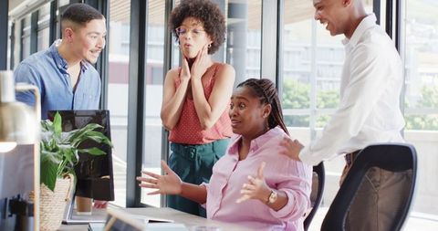 Diverse Team Celebrating Office Success Together with Enthusiasm