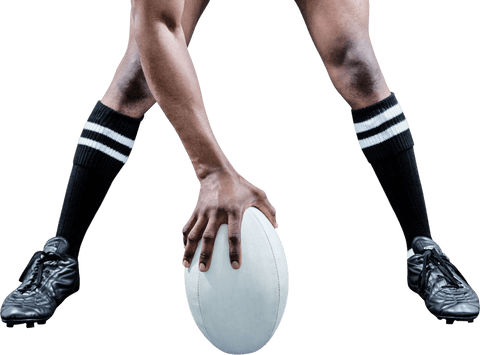 Rugby player holding ball with focus on legs and footwear