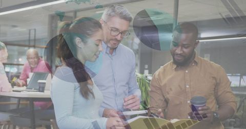 Diverse Business Team Analyzing Financial Data at Modern Office