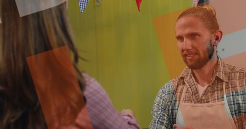 Shopkeeper Assisting Customer During Cyber Monday Sale Event