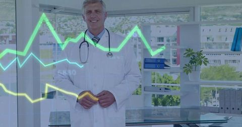Senior male doctor standing in modern clinic with glowing ECG overlay and stethoscope