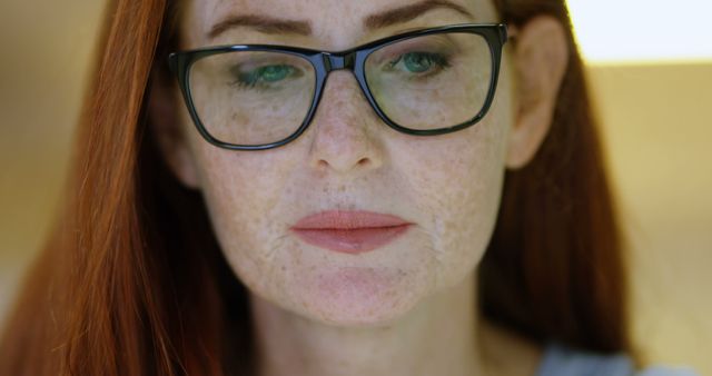 Thoughtful Woman with Red Hair and Glasses - Download Free Stock Images Pikwizard.com