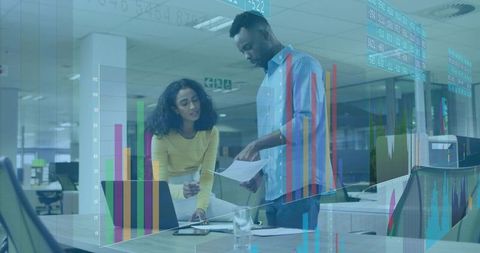 Business Meeting of Professionals Analyzing Financial Reports in Office