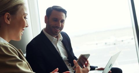 Business Professionals Networking at Airport Lounge