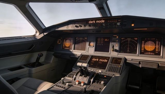 Modern jet cockpit featuring amber dark-mode avionics, twin thrust levers and sidestick