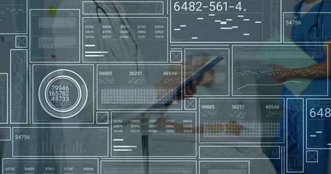 Doctors Using Digital Tablets Reviewing Medical Data in Clinic