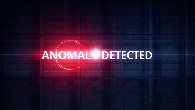 Digital display showing 'anomaly detected' with red lens flare effect