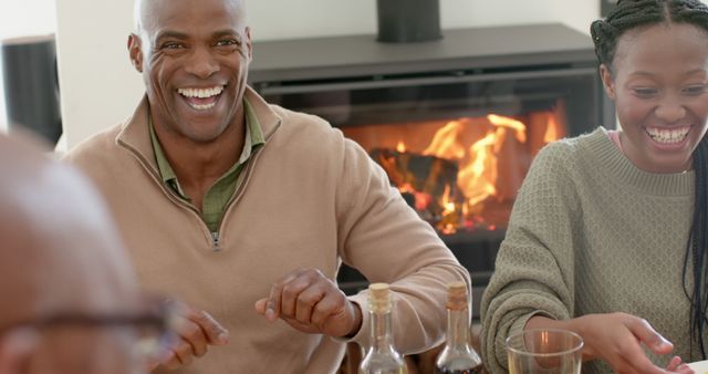 Happy African American Family Enjoying Meal Together by Fireplace - Download Free Stock Images Pikwizard.com