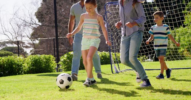 Family Playing Soccer Together in the Backyard on a Sunny Day - Download Free Stock Images Pikwizard.com