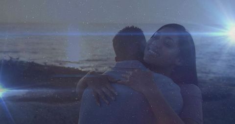 Couple Embracing on Scenic Oceanfront at Dusk