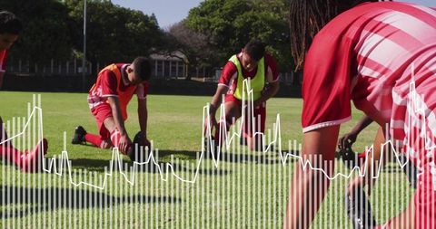 Youth soccer team stretching on grass pitch with red uniforms and white waveform overlay