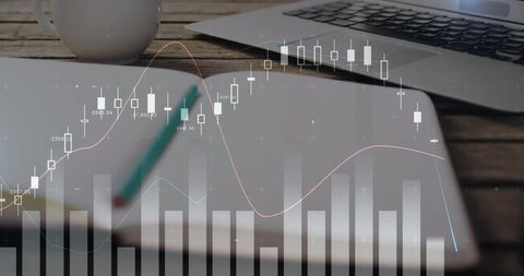 Financial market trends analyzed with technology tools on desk