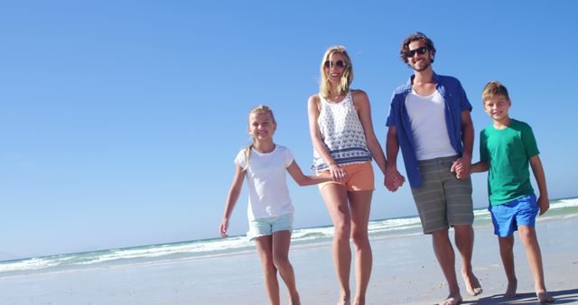 Happy Family Walking on Sunny Beach - Download Free Stock Images Pikwizard.com