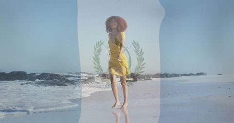 Woman in yellow dress walking on serene coast