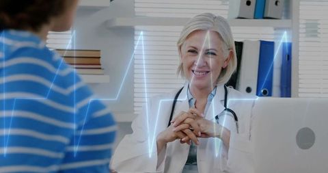 Caucasian Female Doctor Consulting with Patient