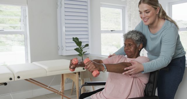 Senior Woman Lifting Weights with Caregiver Assistance - Download Free Stock Images Pikwizard.com