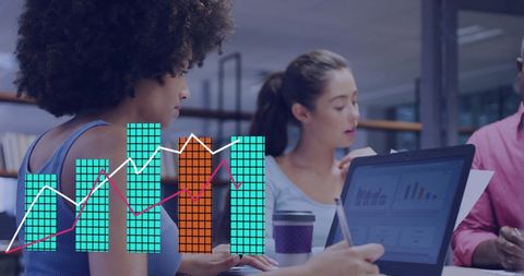 Diverse Team Analyzing Digital Financial Data in Modern Office Space