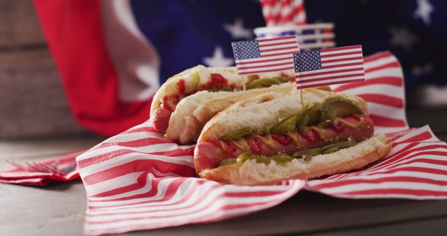 Image of hot dogs with mustard and ketchup over flag of usa on a wooden surface. food, cuisine and catering ingredients.