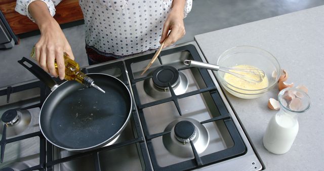 Woman Preparing Breakfast Omelette in Domestic Kitchen - Download Free Stock Images Pikwizard.com