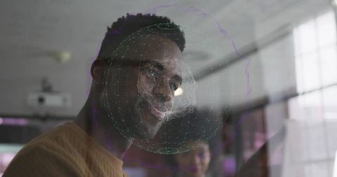 Tech professional interacting with holographic display in modern office