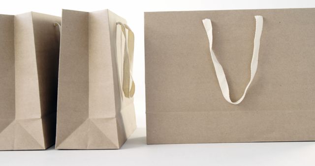 Eco-Friendly Brown Paper Shopping Bags with Handles - Download Free Stock Images Pikwizard.com