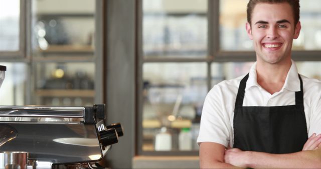 Smiling Barista Standing in Coffee Shop with Arms Crossed - Download Free Stock Images Pikwizard.com