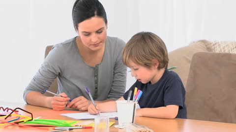 Mother and Son Engaging in an Arts and Crafts Activity at Home