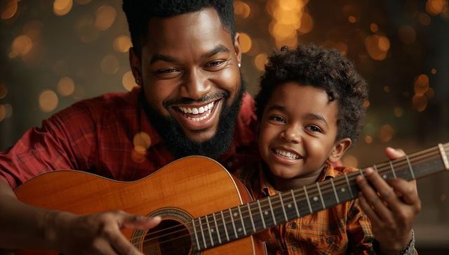 Father and Son Enjoy Strumming Guitar Together at Home