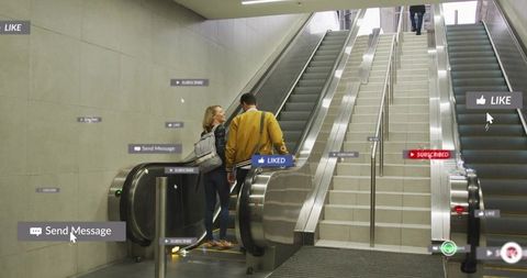 Couple chatting on escalator with augmented social media overlay in modern transit hub