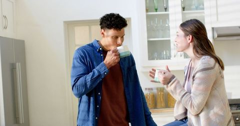 Happy Couple Sharing Coffee in Cozy Kitchen Atmosphere