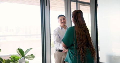 Business Colleagues Engaging in Active Discussion at Office