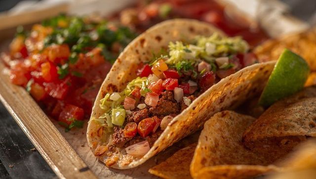 Rustic Beef Tacos with Salsa and Lime Garnish in Restaurant