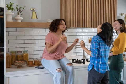 Diverse Friends Socializing in Modern Kitchen with Relaxed Atmosphere