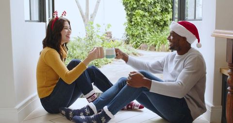 Festive Couple enjoying Holiday Outdoors