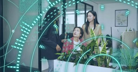 Team Collaborates on Code with Futuristic Digital Overlay in Modern Office