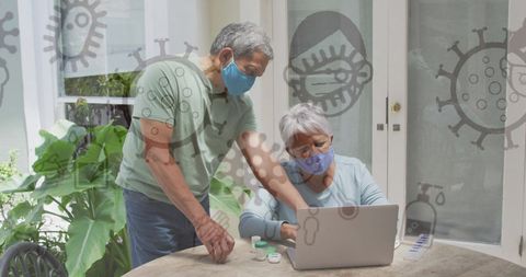 Senior Couple Using Laptop with COVID-19 Icons Overlay - Download Free Stock Images Pikwizard.com