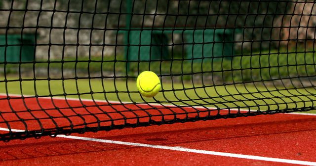 Tennis Ball Striking Net on Outdoor Red Court - Download Free Stock Images Pikwizard.com
