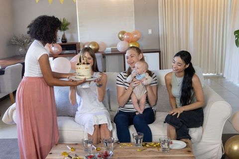 Multi-ethnic Friends Celebrating with Cake and Infant