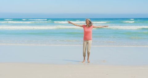 Elderly Woman Enjoying Peaceful Beach Day - Download Free Stock Images Pikwizard.com